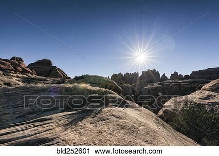 "Sun in blue sky over desert, Moab, Utah, United States" View Large Photo Image Stock Image - "Sun in blue sky over desert, Moab, Utah, United States". Fotosearch