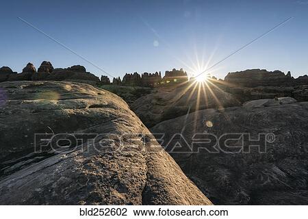 "Sun in blue sky over desert, Moab, Utah, United States" View Large Photo Image Stock Image - "Sun in blue sky over desert, Moab, Utah, United States". Fotosearch