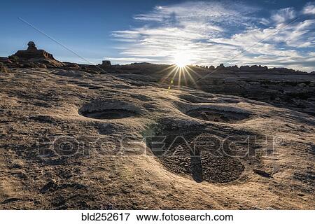Stock Photo - "Sun in blue sky over desert, Moab, Utah, United States". Fotosearch