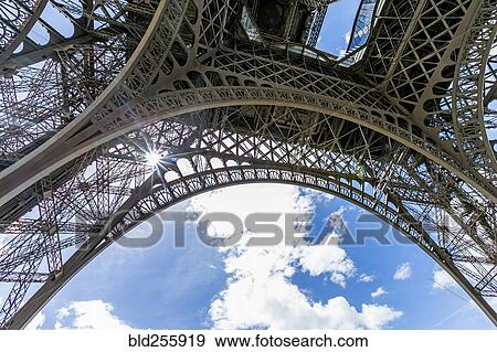 "Sunbeams through metal beams of Eiffel Tower, Paris, Ile de France, France" View Large Photo Image Stock Photo - "Sunbeams through metal beams of Eiffel Tower, Paris, Ile de France, France". Fotosearch