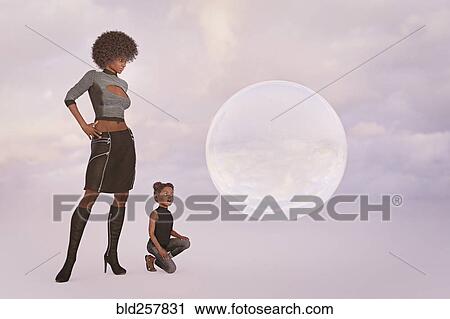 Stock Image - Surprised mother and daughter watching floating sphere. Fotosearch