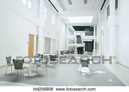 Stock Photograph - Tables and chairs in empty lobby. Fotosearch