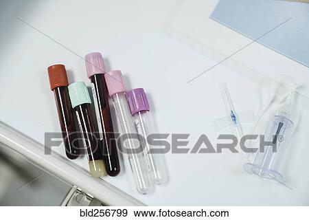 Test tubes with caps on table near syringe View Large Photo Image Stock Photo - Test tubes with caps on table near syringe. Fotosearch
