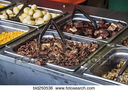 Tongs at food buffet View Large Photo Image Stock Photograph - Tongs at food buffet. Fotosearch
