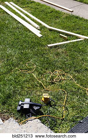 Tools laying in grass View Large Photo Image Stock Image - Tools laying in grass. Fotosearch
