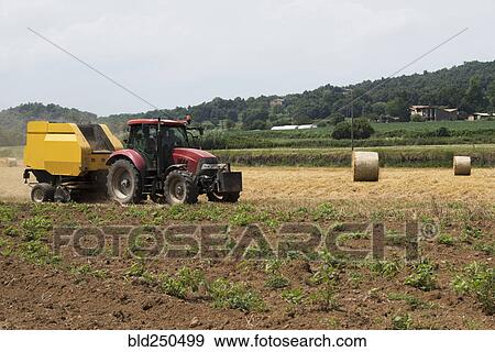 Tractor in field View Large Photo Image Stock Photo - Tractor in field. Fotosearch
