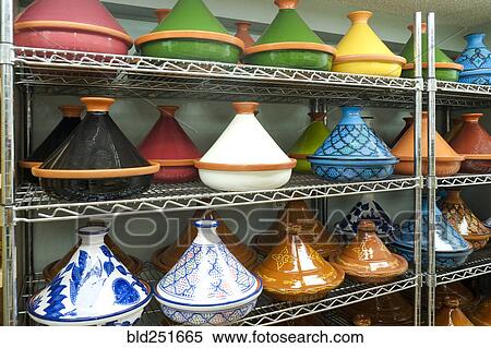 Variety of pots on shelf in store View Large Photo Image Stock Photography - Variety of pots on shelf in store. Fotosearch