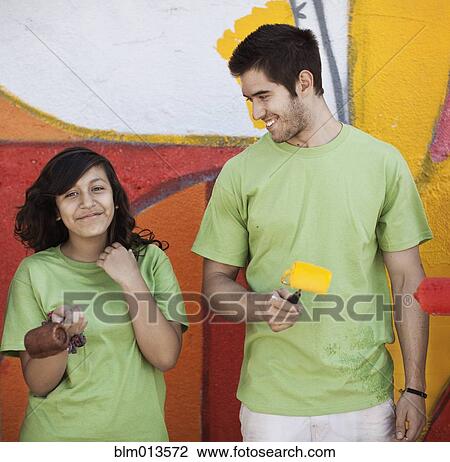 Volunteers painting wall View Large Photo Image Stock Image - Volunteers painting wall. Fotosearch