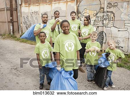 Stock Image - Volunteers picking up litter. Fotosearch