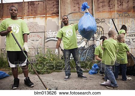 Stock Photograph - Volunteers picking up litter. Fotosearch