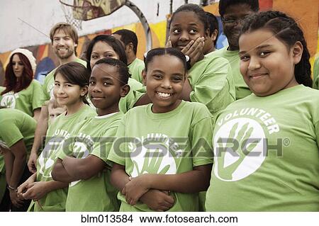 Volunteers standing together View Large Photo Image Picture - Volunteers standing together. Fotosearch