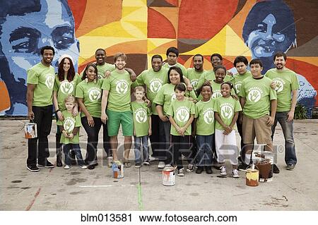 Volunteers standing together View Large Photo Image Stock Image - Volunteers standing together. Fotosearch