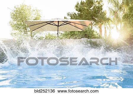 Water splashing in swimming pool View Large Photo Image Stock Photograph - Water splashing in swimming pool. Fotosearch