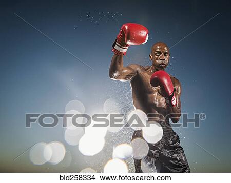 Picture - Water splashing on Black boxer. Fotosearch