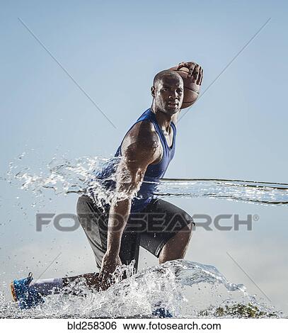 Water splashing on Black man dribbling basketball View Large Photo Image Stock Photograph - Water splashing on Black man dribbling basketball. Fotosearch