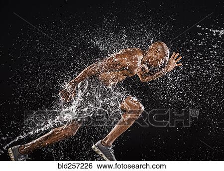Water splashing on black runner View Large Photo Image Stock Photograph - Water splashing on black runner. Fotosearch