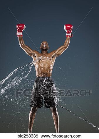 Water splashing on winning Black boxer View Large Photo Image Stock Photography - Water splashing on winning Black boxer. Fotosearch