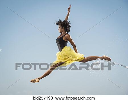 Water spraying on black woman ballet dancing View Large Photo Image Stock Image - Water spraying on black woman ballet dancing. Fotosearch