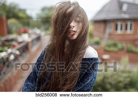 Wind blowing hair of Caucasian girl View Large Photo Image Stock Photo - Wind blowing hair of Caucasian girl. Fotosearch