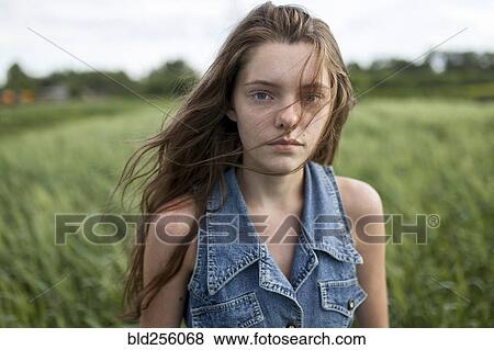 Wind blowing hair of Caucasian woman in field View Large Photo Image Stock Photo - Wind blowing hair of Caucasian woman in field. Fotosearch