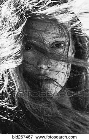 Stock Photo - Wind blowing hair of Caucasian woman. Fotosearch