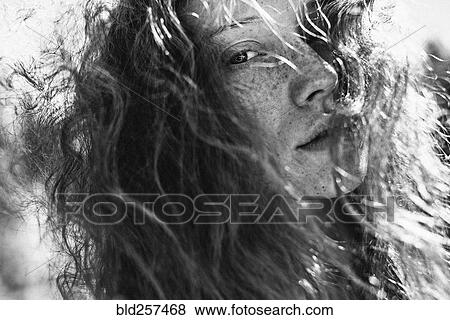 Wind blowing hair of Caucasian woman View Large Photo Image Stock Photo - Wind blowing hair of Caucasian woman. Fotosearch