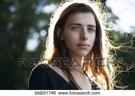 Stock Photograph - Wind blowing hair of Caucasian woman. Fotosearch