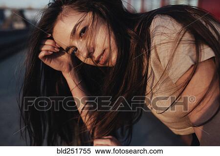 Wind blowing hair of Caucasian woman View Large Photo Image Stock Photography - Wind blowing hair of Caucasian woman. Fotosearch