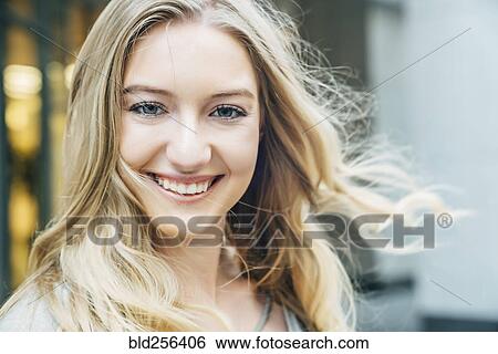 Wind blowing hair of smiling Caucasian woman View Large Photo Image Stock Photograph - Wind blowing hair of smiling Caucasian woman. Fotosearch