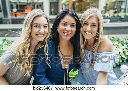 Wind blowing hair of smiling women View Large Photo Image Stock Photo - Wind blowing hair of smiling women. Fotosearch