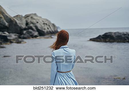 Wind blowing hair of woman at ocean View Large Photo Image Stock Image - Wind blowing hair of woman at ocean. Fotosearch