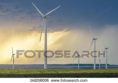 Stock Photograph - Wind turbines at sunset. Fotosearch