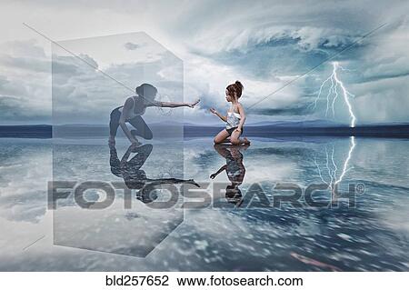 Woman in cube reaching to kneeling girl View Large Photo Image Stock Image - Woman in cube reaching to kneeling girl. Fotosearch