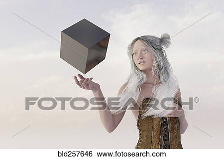 Stock Photograph - Woman watching floating cube. Fotosearch