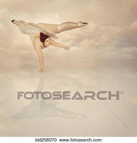 Woman wearing corset and boots balancing on hand in clouds View Large Photo Image Stock Image - Woman wearing corset and boots balancing on hand in clouds. Fotosearch