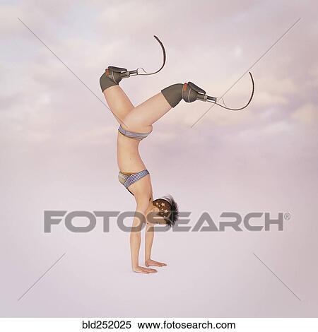 Stock Photography - Woman with artificial legs performing handstand. Fotosearch