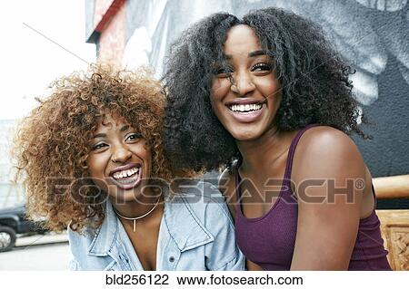 Women laughing outdoors View Large Photo Image Stock Image - Women laughing outdoors. Fotosearch