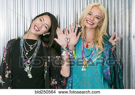 Women showing heart on hands View Large Photo Image Picture - Women showing heart on hands. Fotosearch