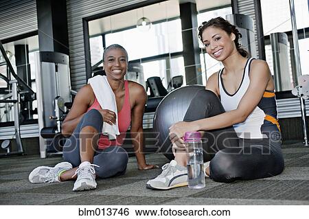 Stock Photograph - Women sitting together in health club. Fotosearch