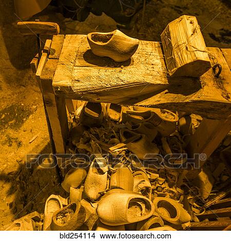 Picture - Wooden clogs near workbench. Fotosearch