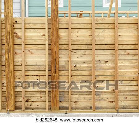 Stock Photography - Wooden wall at construction site. Fotosearch