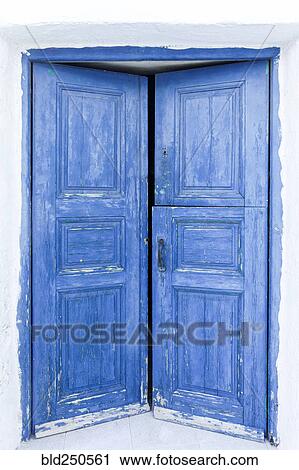 Stock Image - Worn blue doors. Fotosearch
