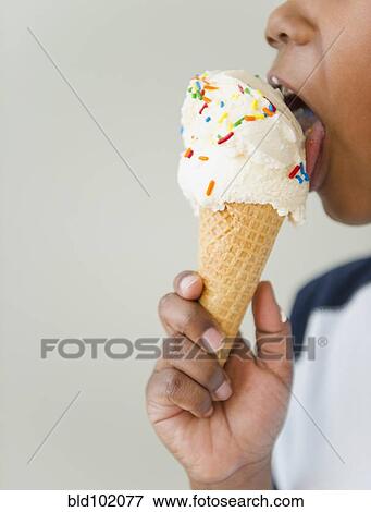 Black boy licking ice cream cone View Large Photo Image Stock Photo - Black boy licking ice cream cone. Fotosearch