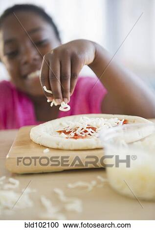 Black girl making pizza View Large Photo Image Stock Image - Black girl making pizza. Fotosearch