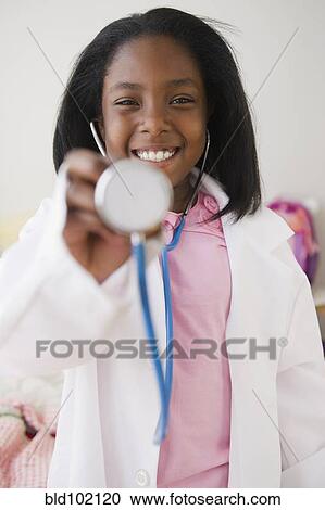 Black girl pretending to be a doctor View Large Photo Image Stock Image - Black girl pretending to be a doctor. Fotosearch