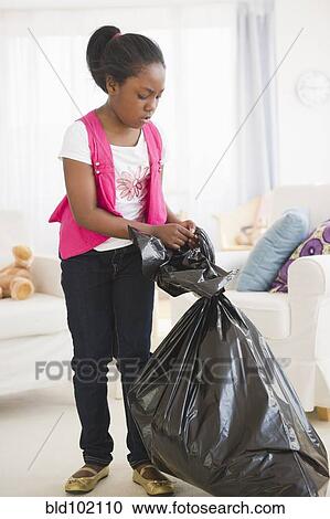 Black girl taking out the garbage View Large Photo Image Stock Image - Black girl taking out the garbage. Fotosearch