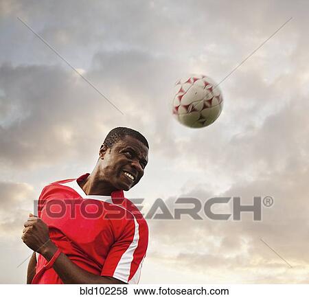 Black soccer player heading the ball View Large Photo Image Stock Photo - Black soccer player heading the ball. Fotosearch