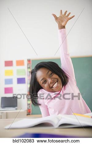 Black student raising arm answering a question View Large Photo Image Stock Image - Black student raising arm answering a question. Fotosearch