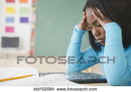 Picture - Black student studying in classroom. Fotosearch