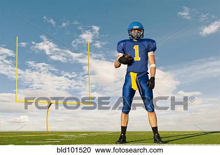 Caucasian football player standing with football View Large Photo Image Stock Image - Caucasian football player standing with football. Fotosearch